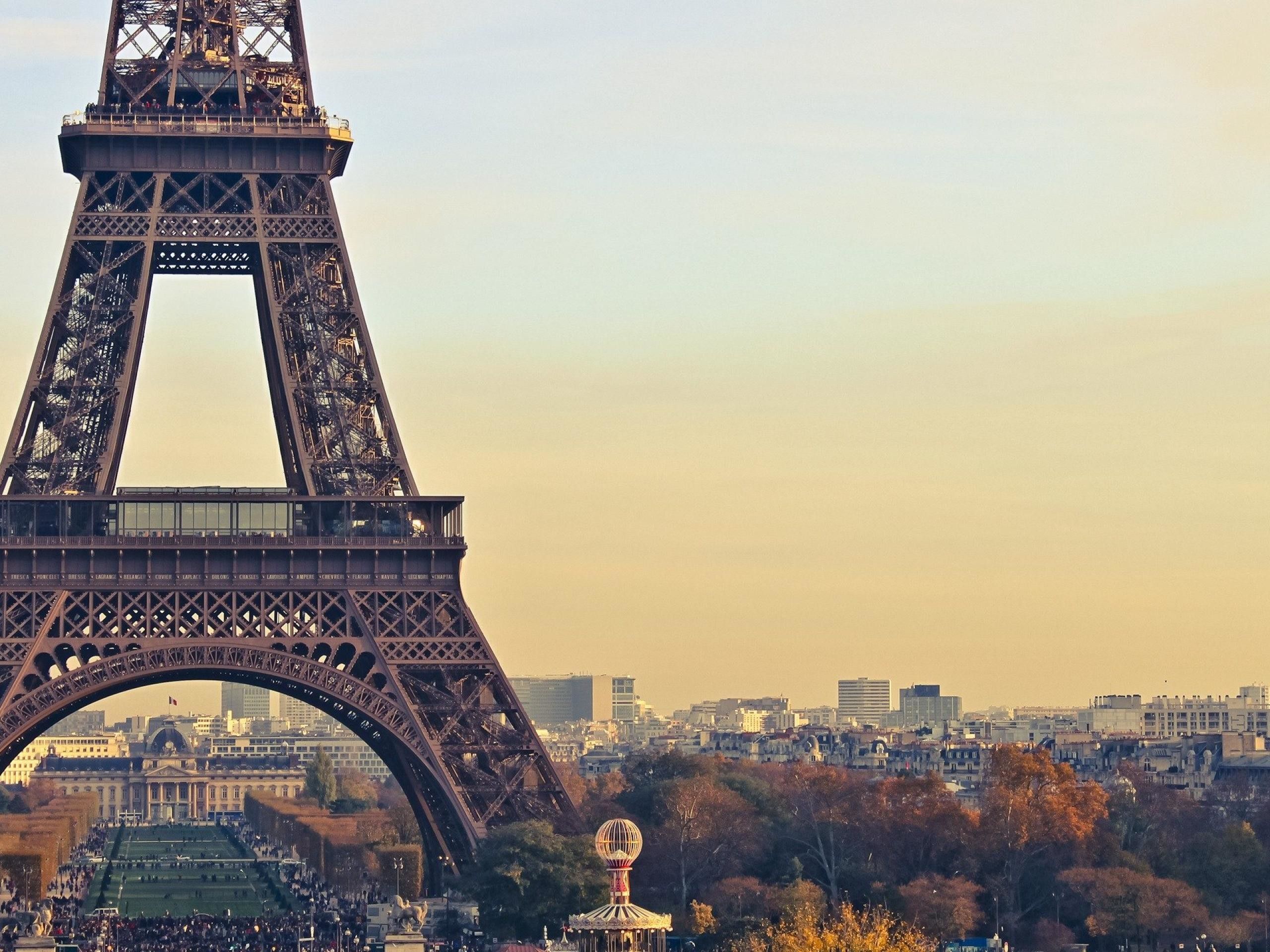 The eiffel tower is seen in a city - Paris