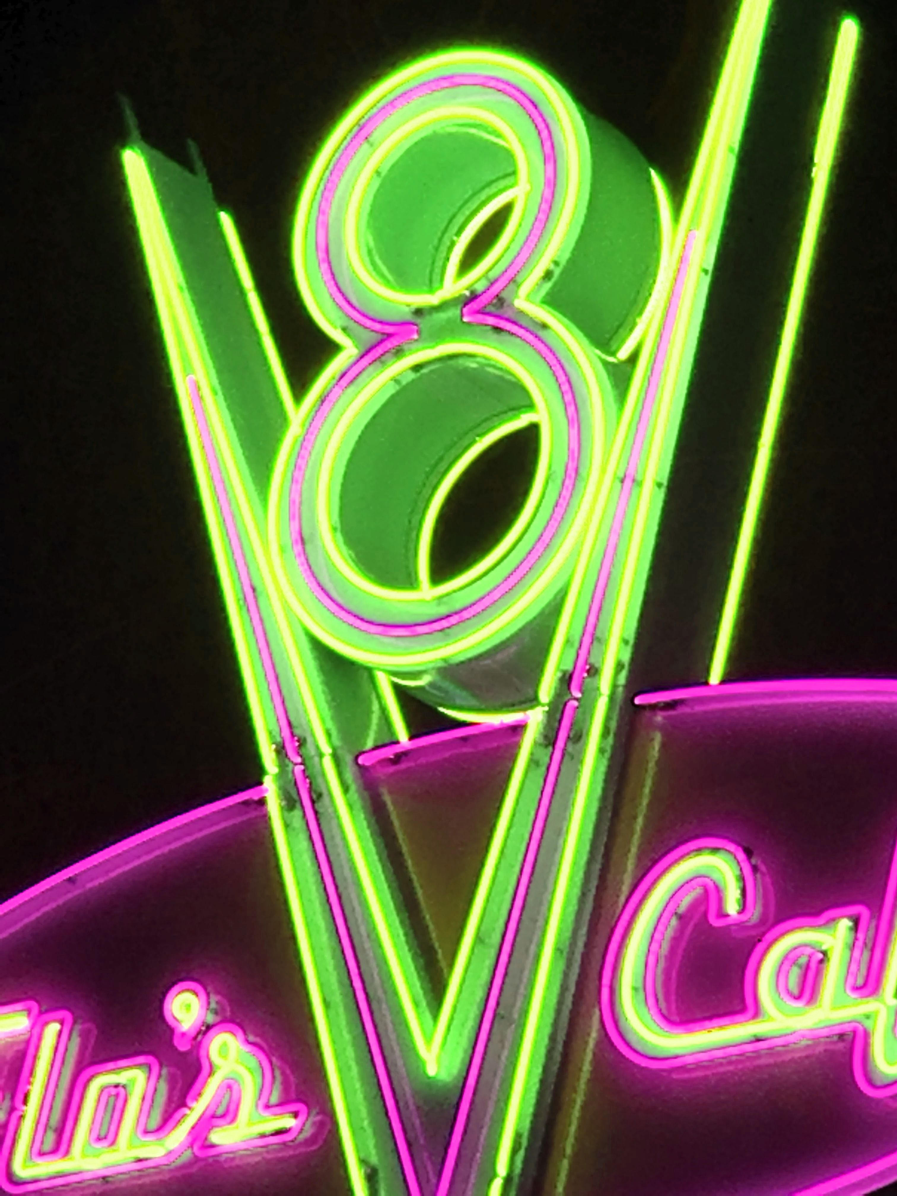A neon sign that says 