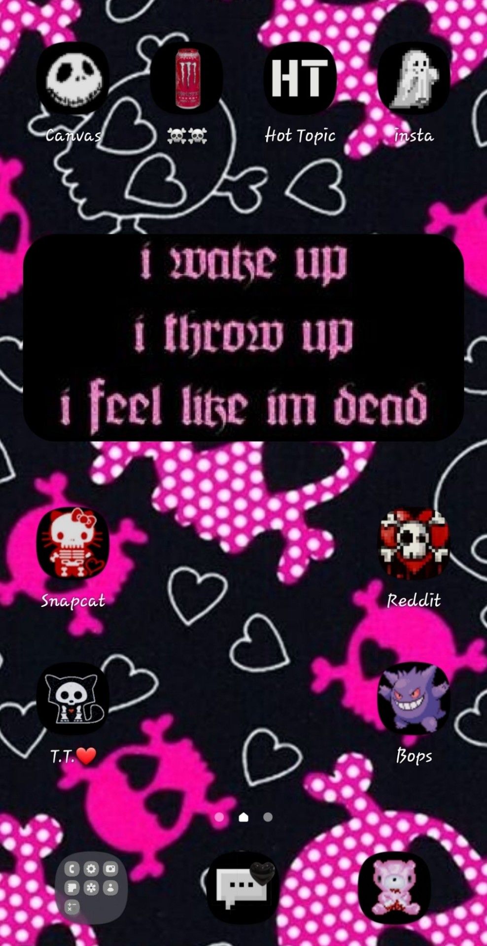 A black and pink phone screen with skulls - 2000s