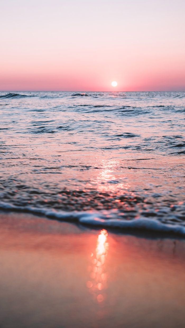 A sunset over the ocean with waves - Summer, sun, sunlight