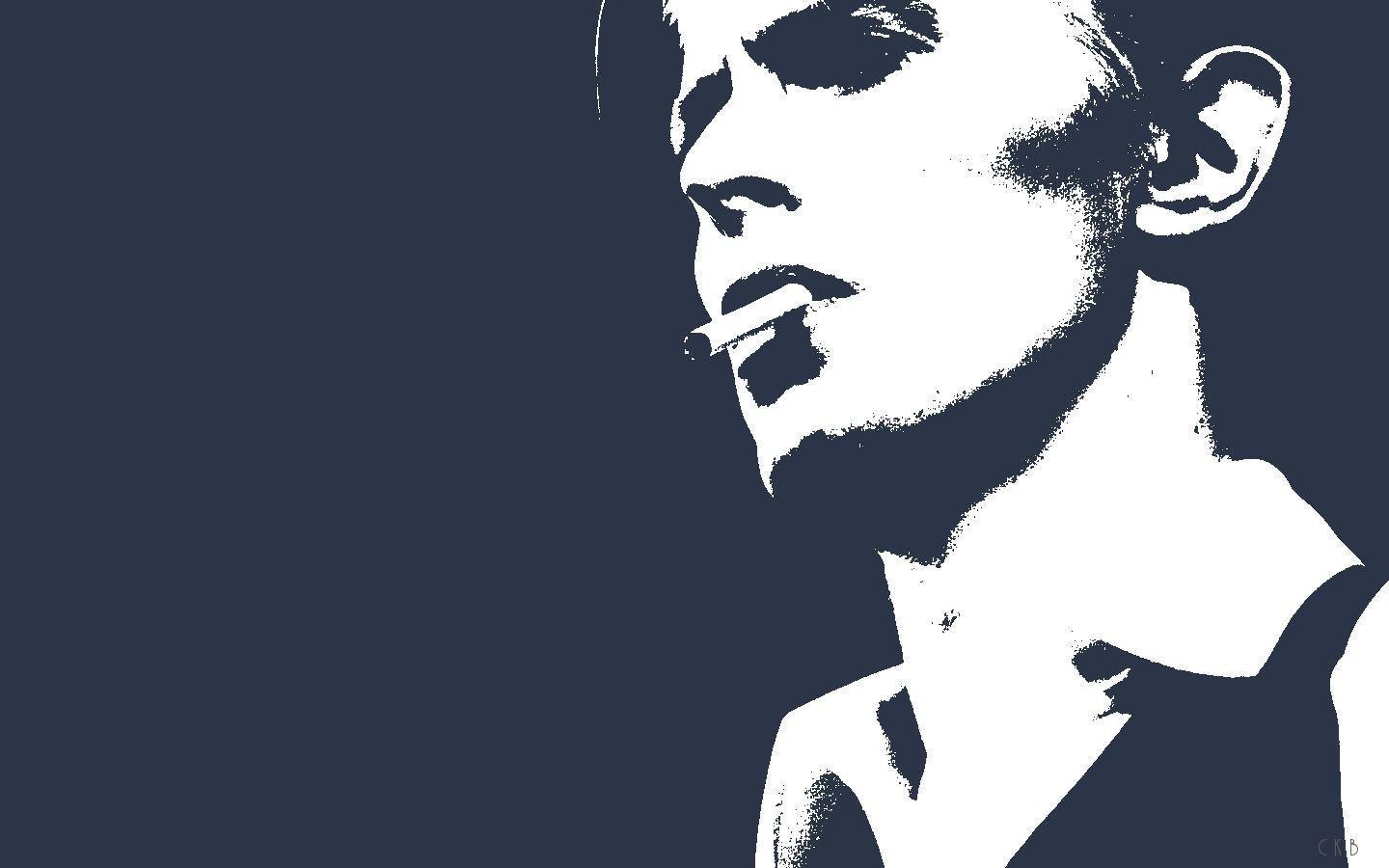 A man with his mouth open and wearing black - David Bowie