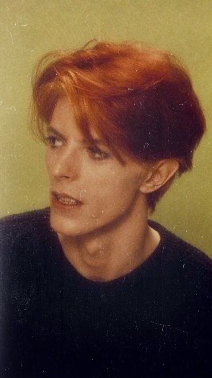 A young man with red hair and black shirt - David Bowie