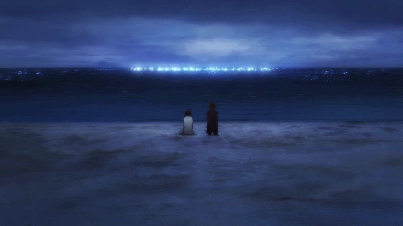 A boy and a girl stand on a beach, looking out at the sea. The sea is lit up with a bright blue light. - Love