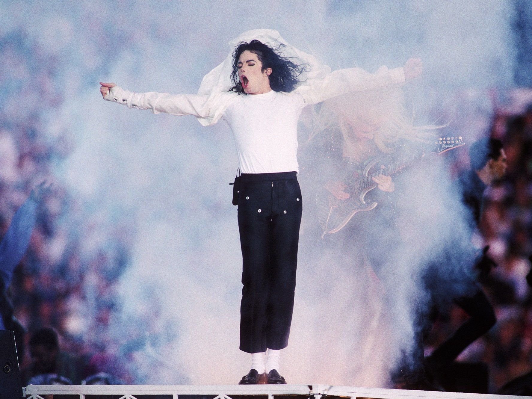 A man in white pants and black shirt - Michael Jackson