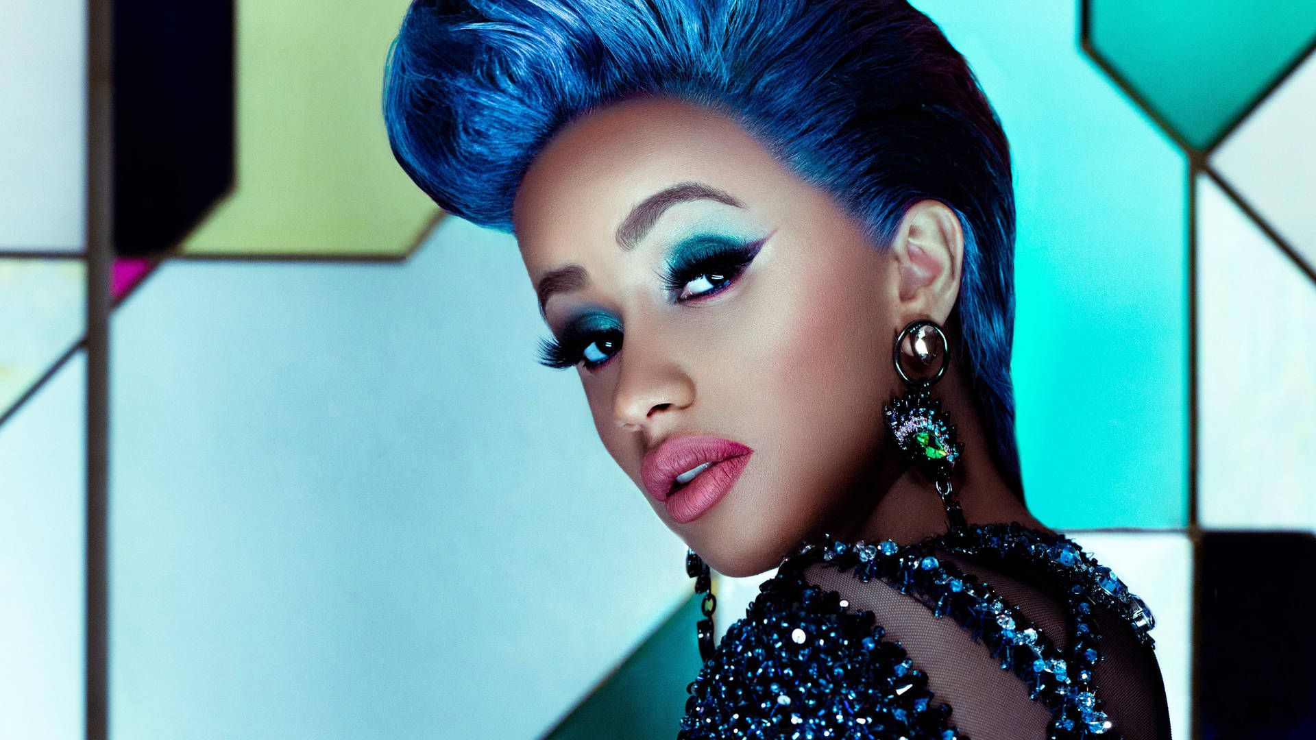 A woman with blue hair and blue eyeshadow - Cardi B