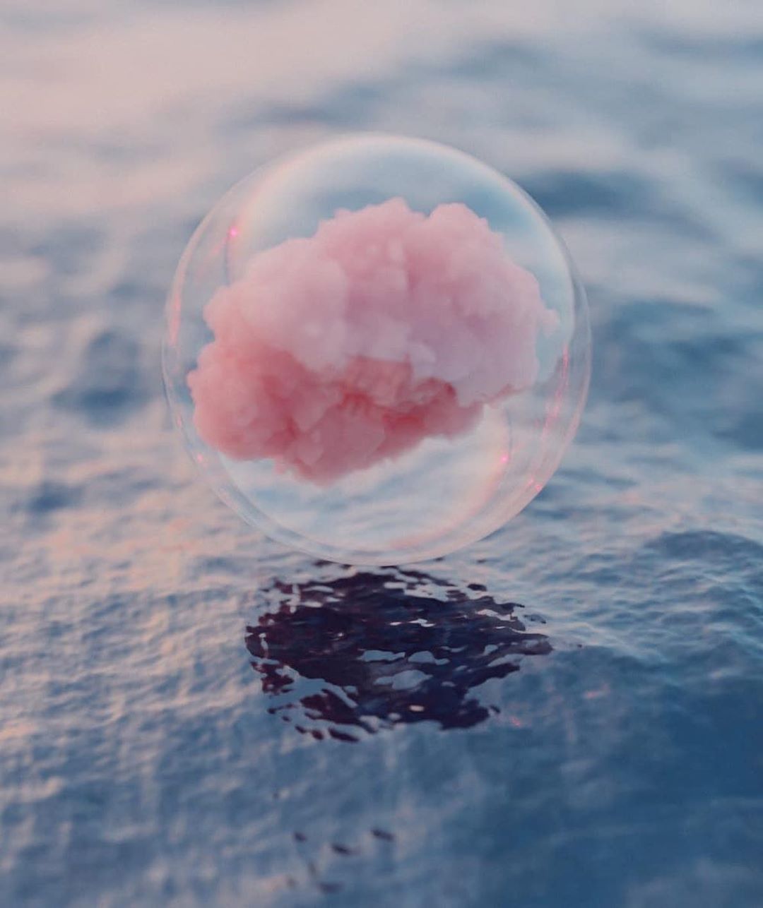 A pink cloud in a bubble floating on water - Bubbles