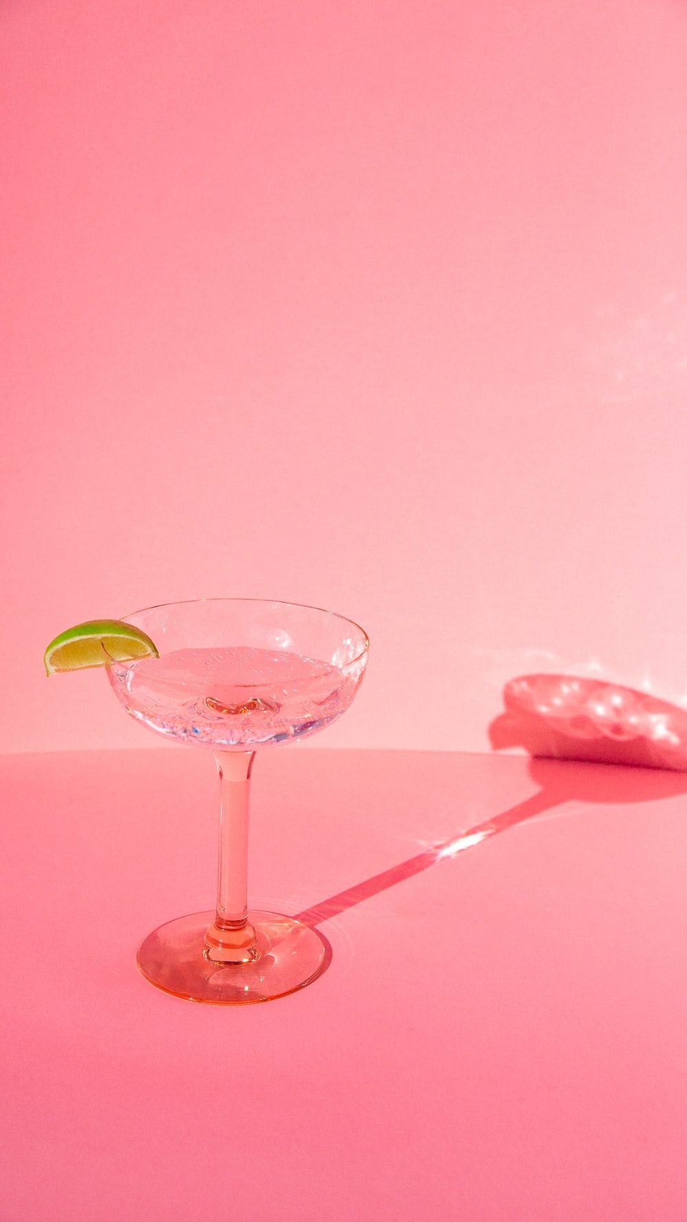 A martini glass with lime on the rim - Champagne