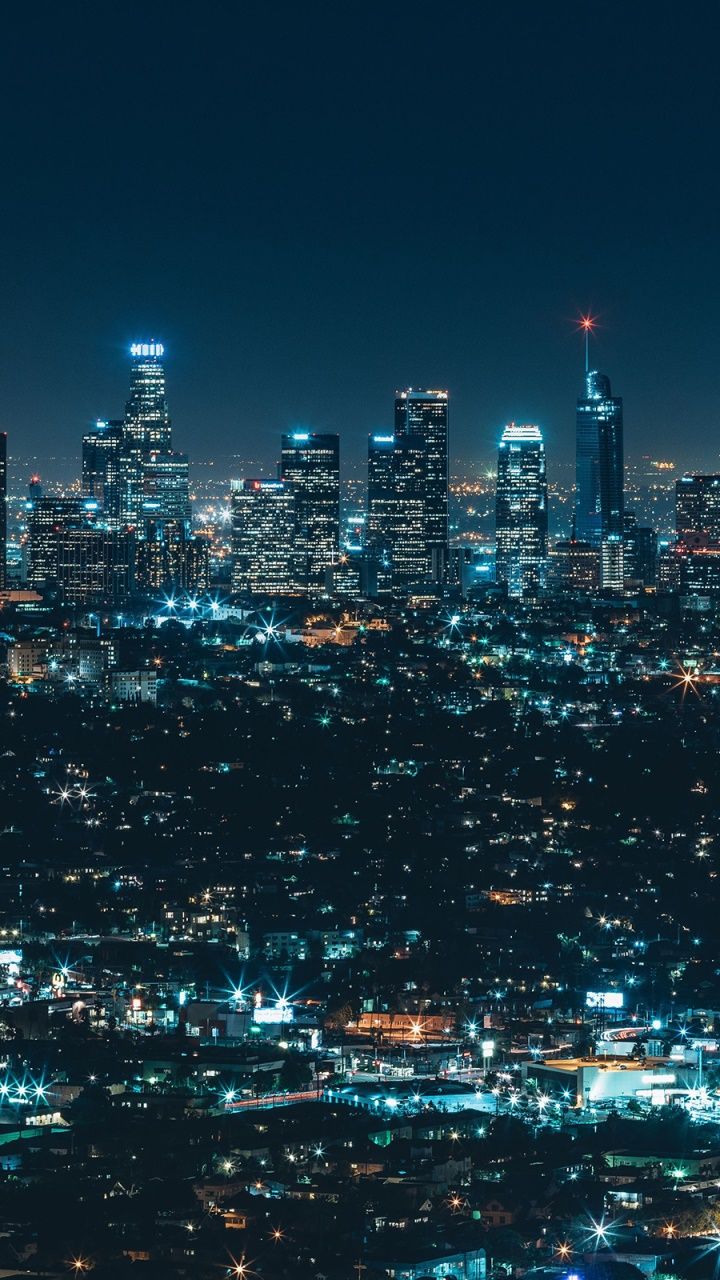 A city skyline at night with lights - Los Angeles