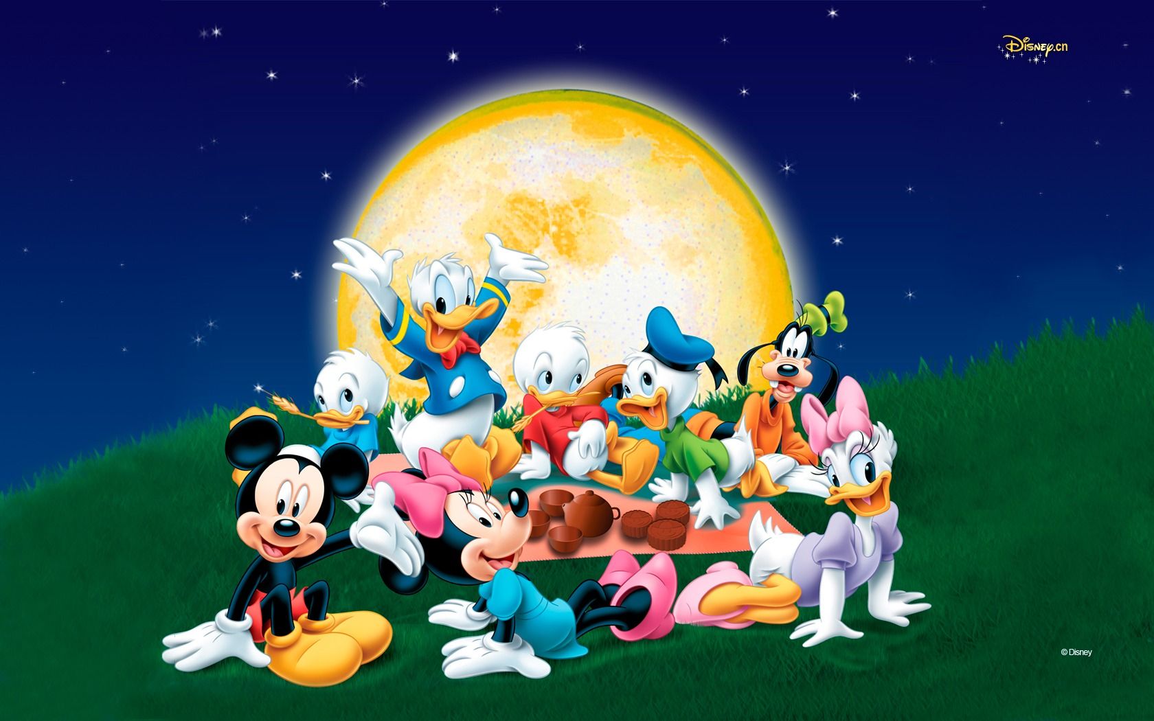 A group of disney characters are sitting on the grass - Minnie Mouse