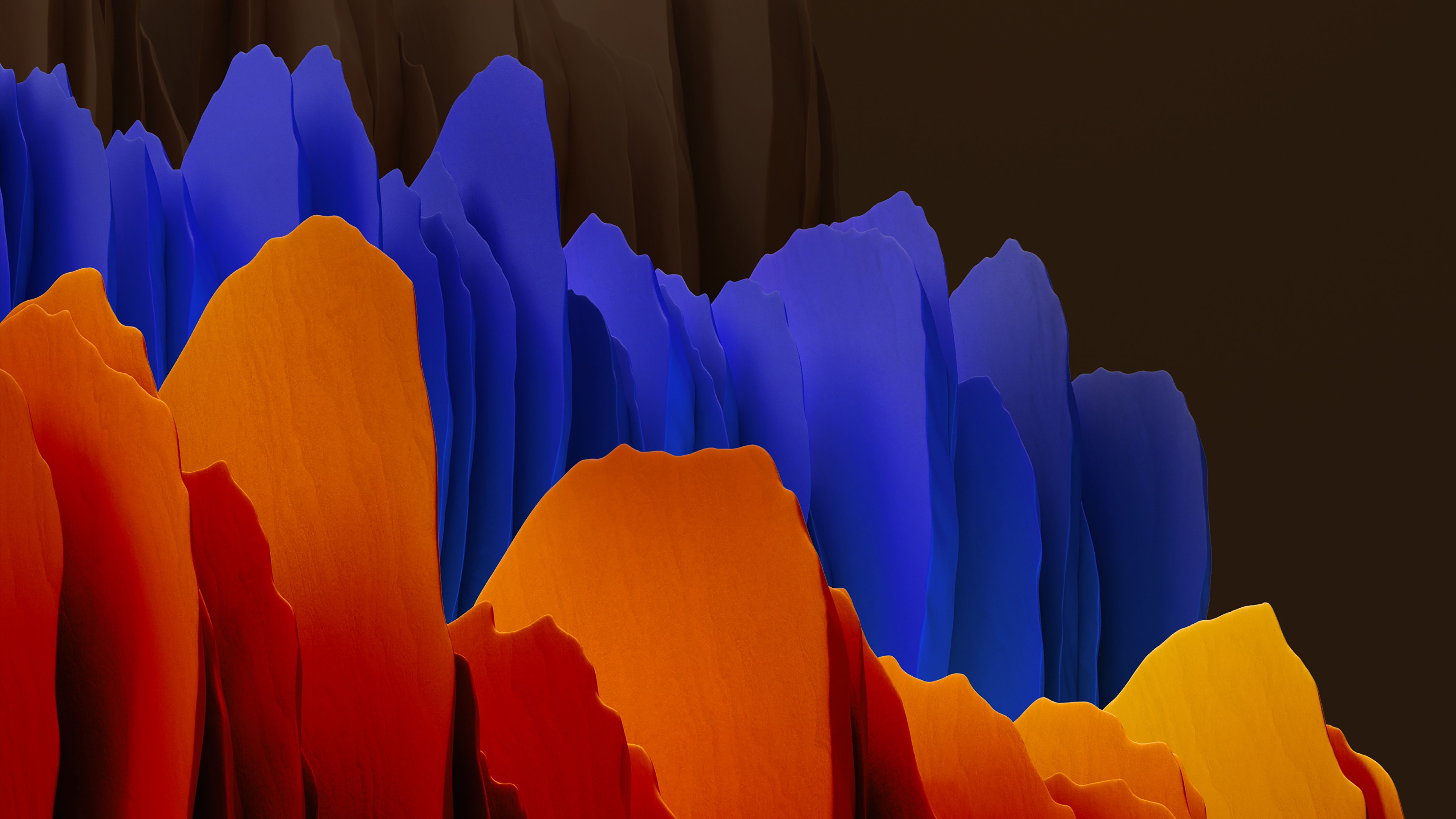 A mountain range of folded paper in blue, red, and orange. - Dark orange