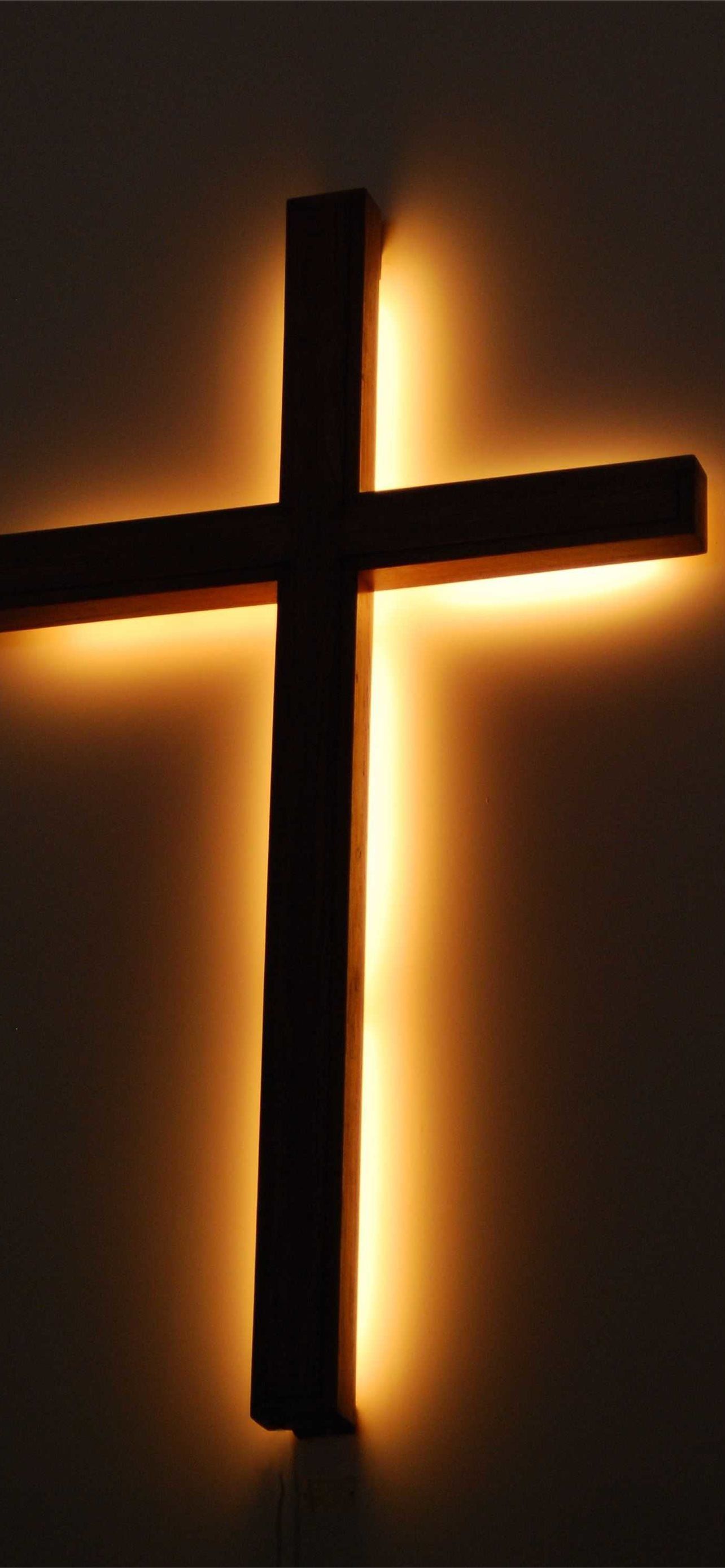 A cross with light shining on it - Cross