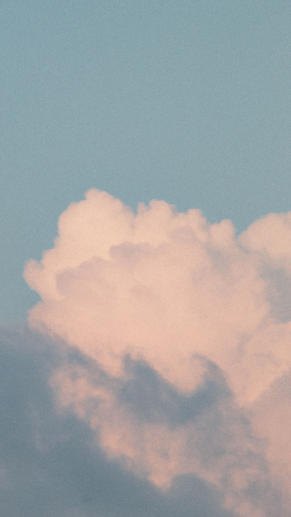A plane flying in the sky with clouds - Light brown, cloud, profile picture