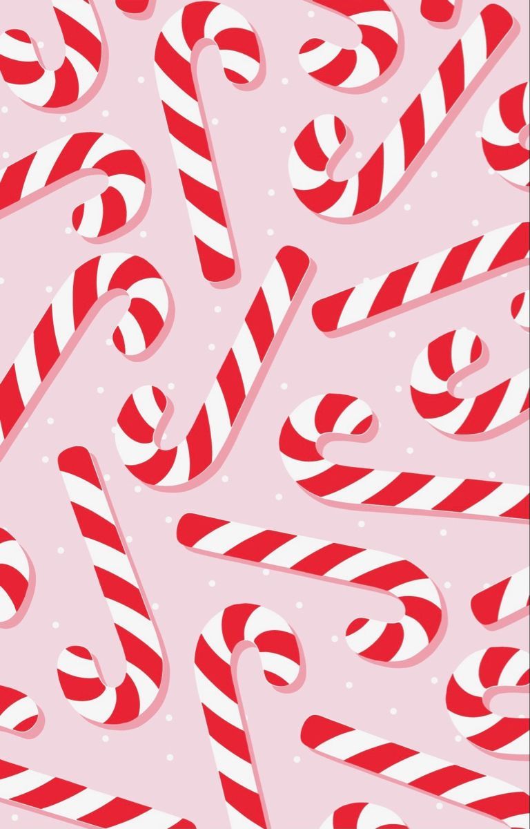 A pattern of candy canes on pink background - Candy cane