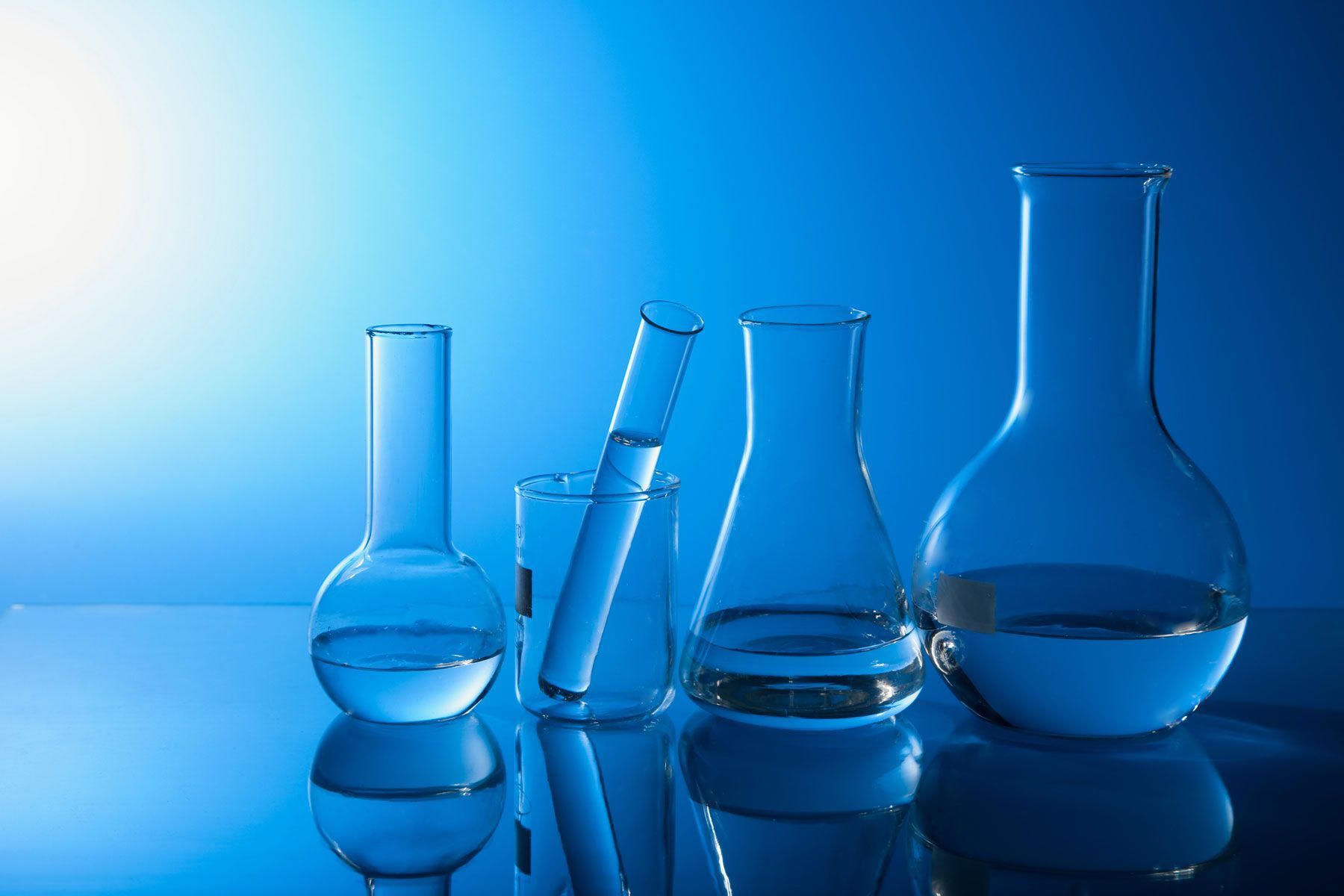 A group of glasses and beakers on top - Chemistry