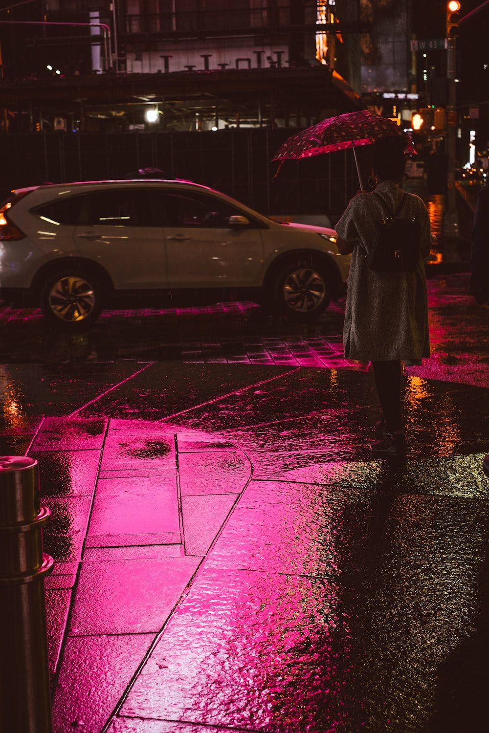 A person walking down the street with an umbrella - Sad