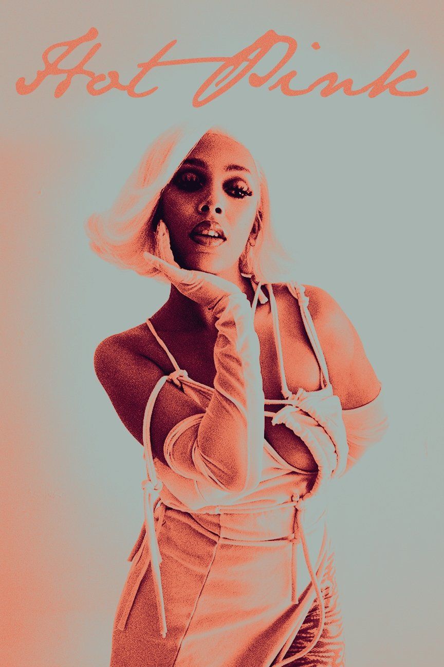 A woman is posing in front of an orange background - Doja Cat