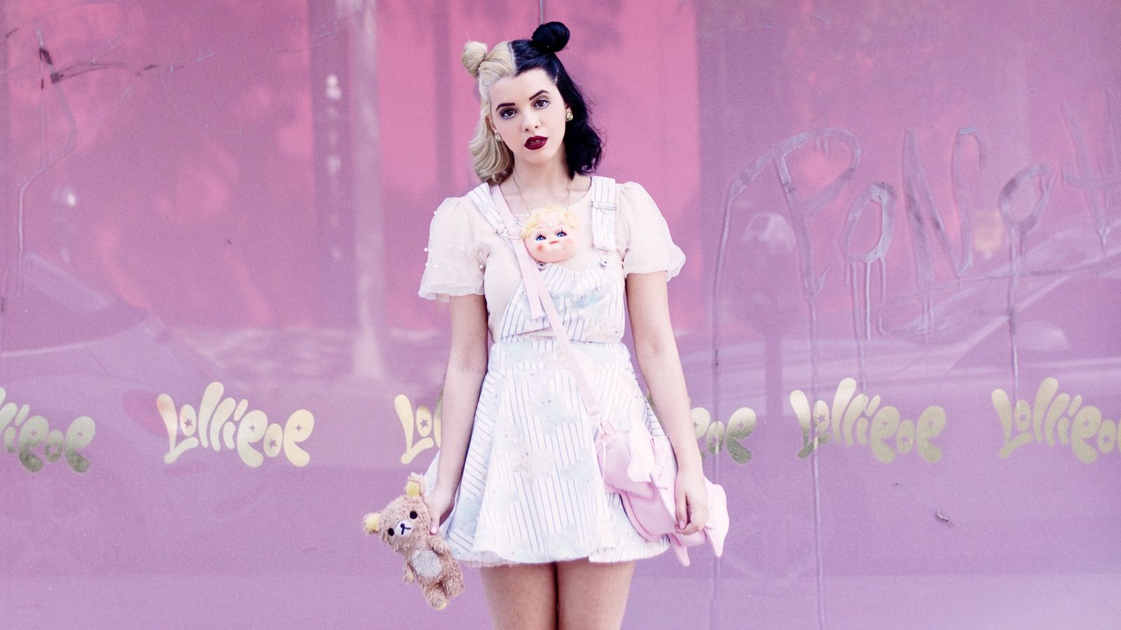 A woman in white dress and pink background - Melanie Martinez