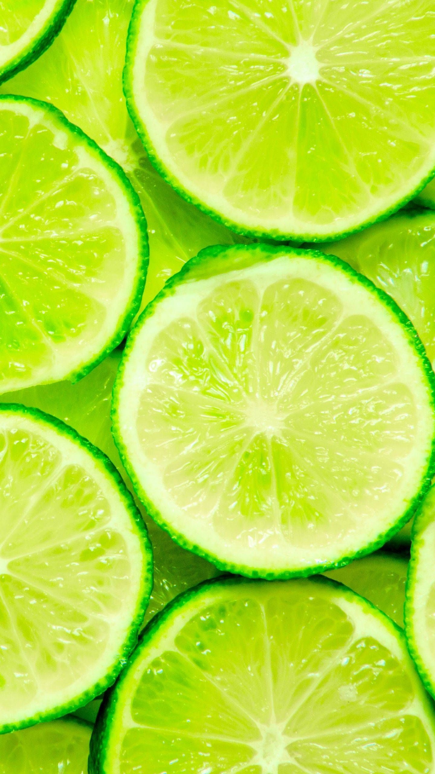 A close up of many slices limes - Lime green