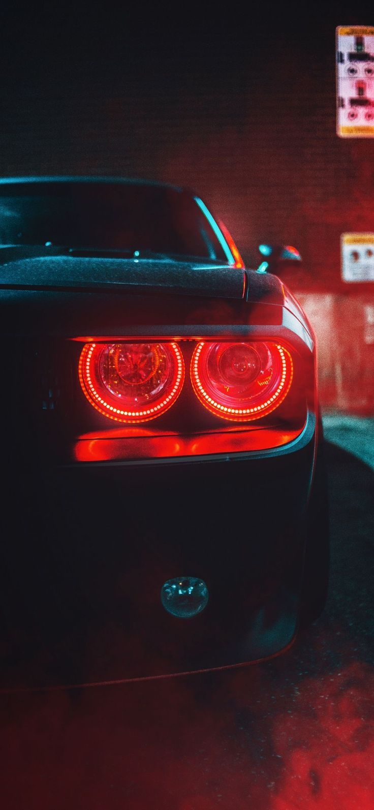 A car with red lights in the night - Cars