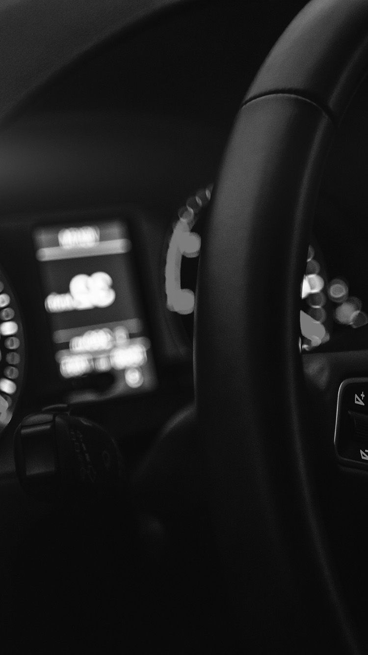 A black and white photo of a car dashboard - Cars