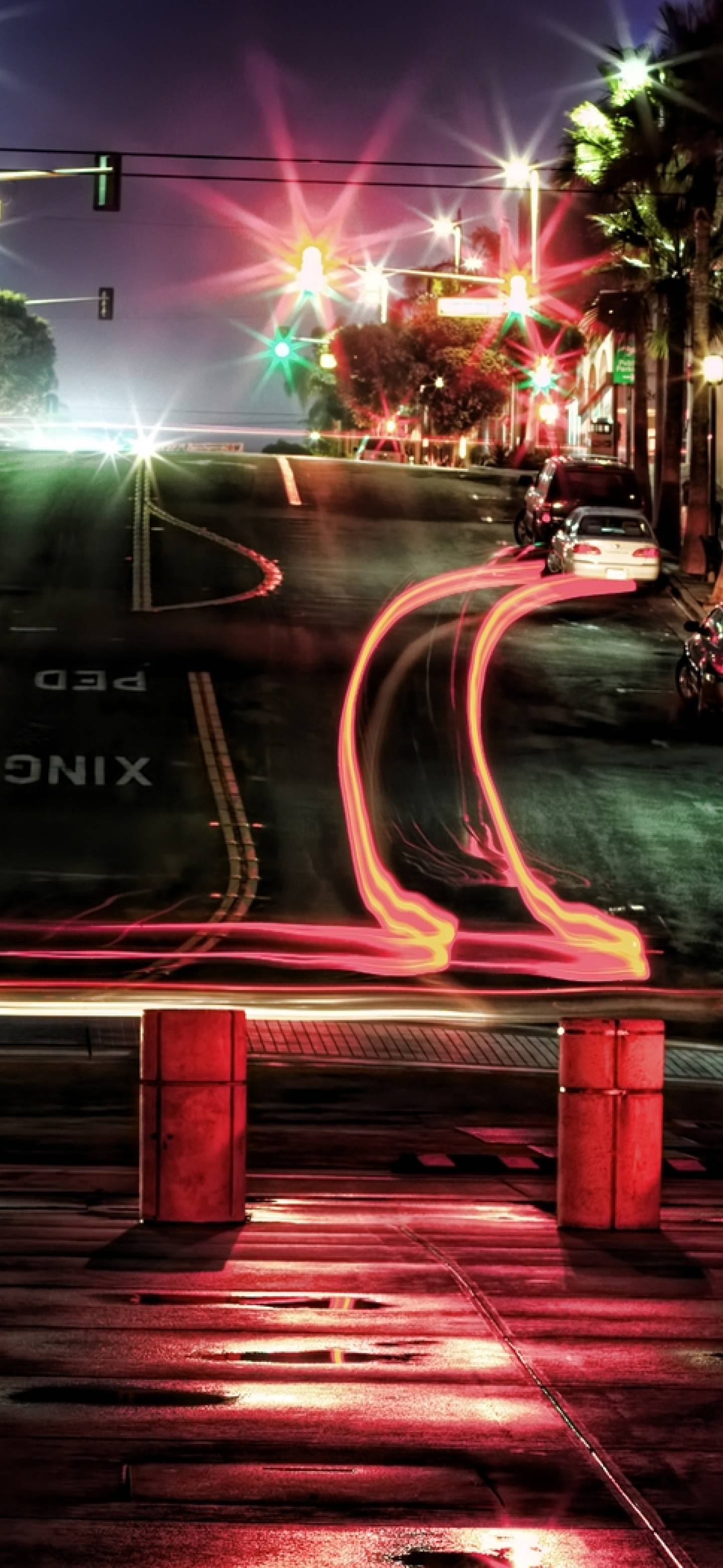 A street with traffic lights and cars at night - Cars