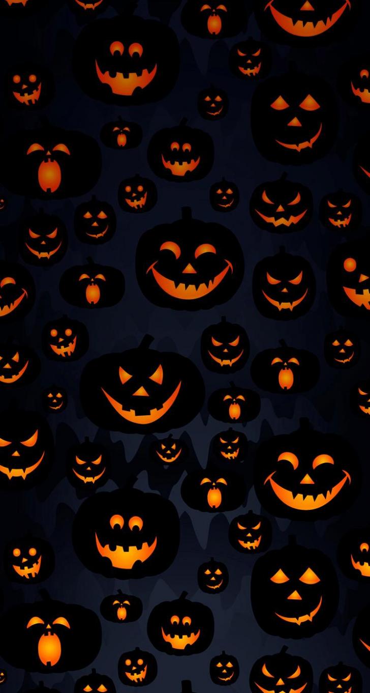 A halloween background with pumpkins and faces - Halloween