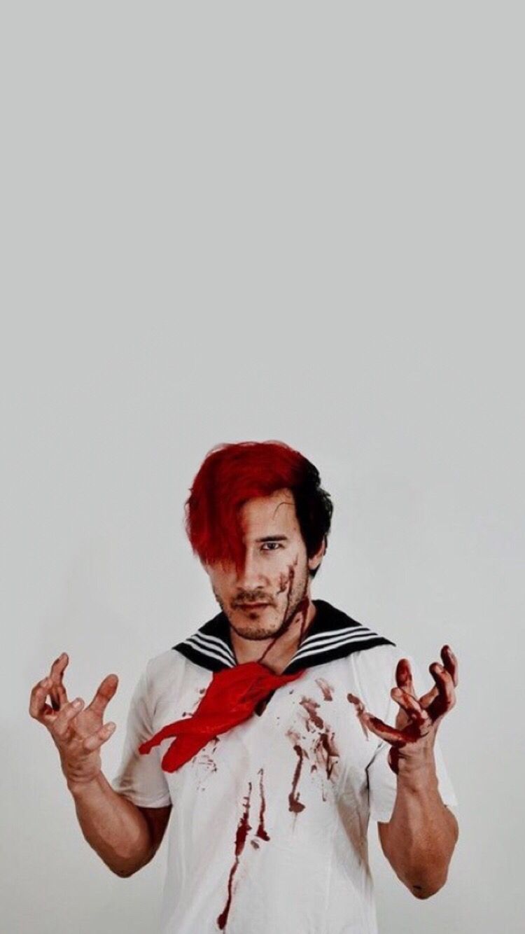 A man with red hair and a bloodied shirt - Markiplier