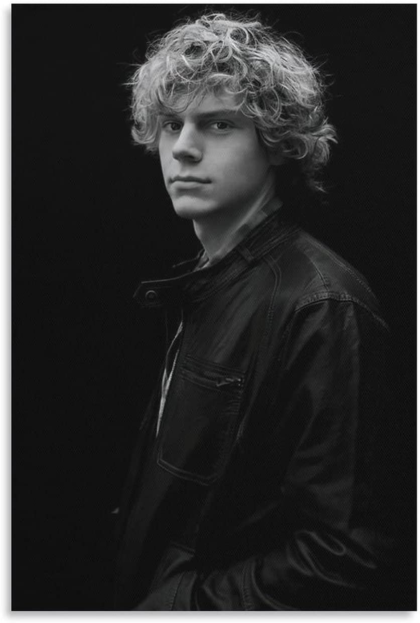 A black and white photo of a young man with curly hair. - Evan Peters