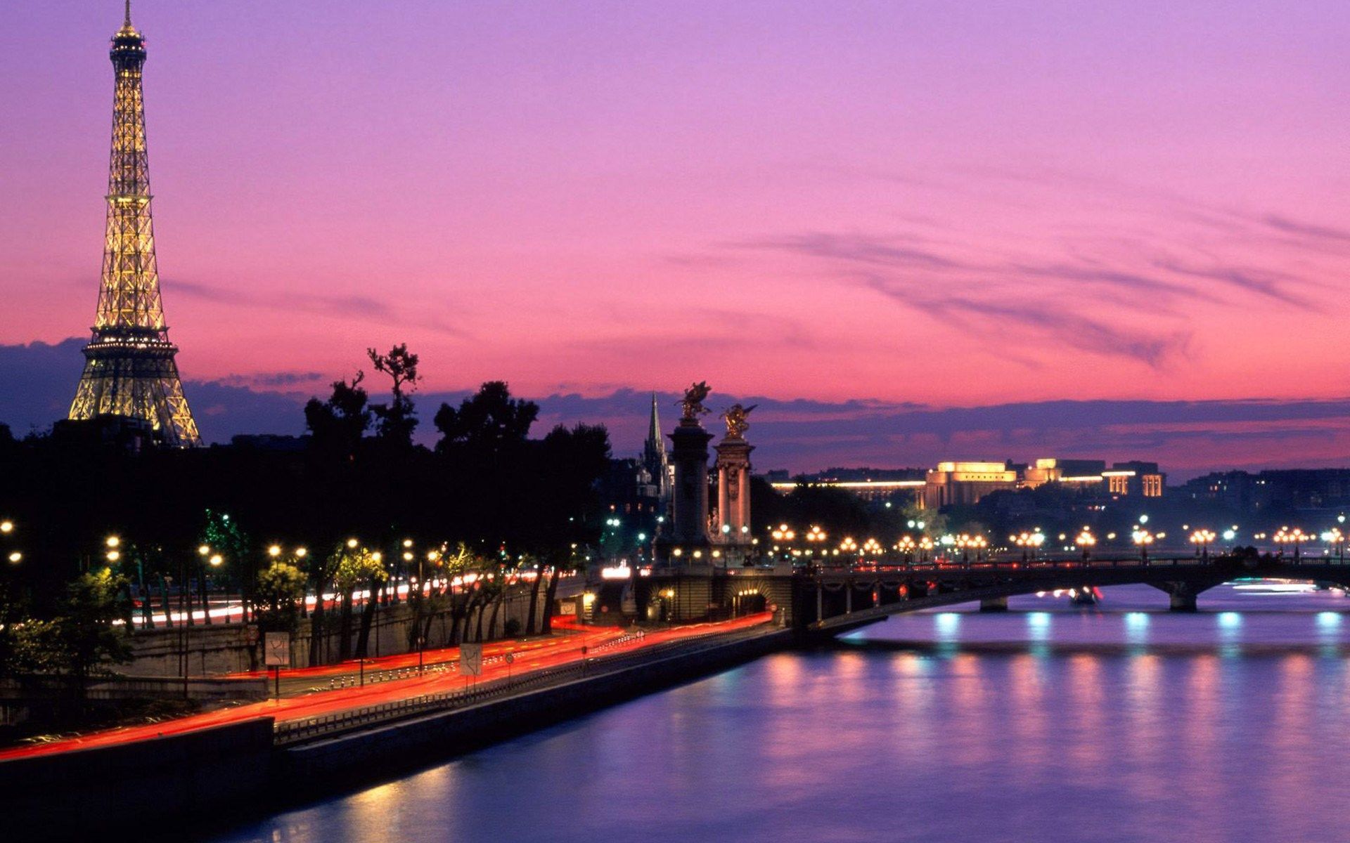 The Eiffel Tower and the Seine River at night in Paris, France. - Paris