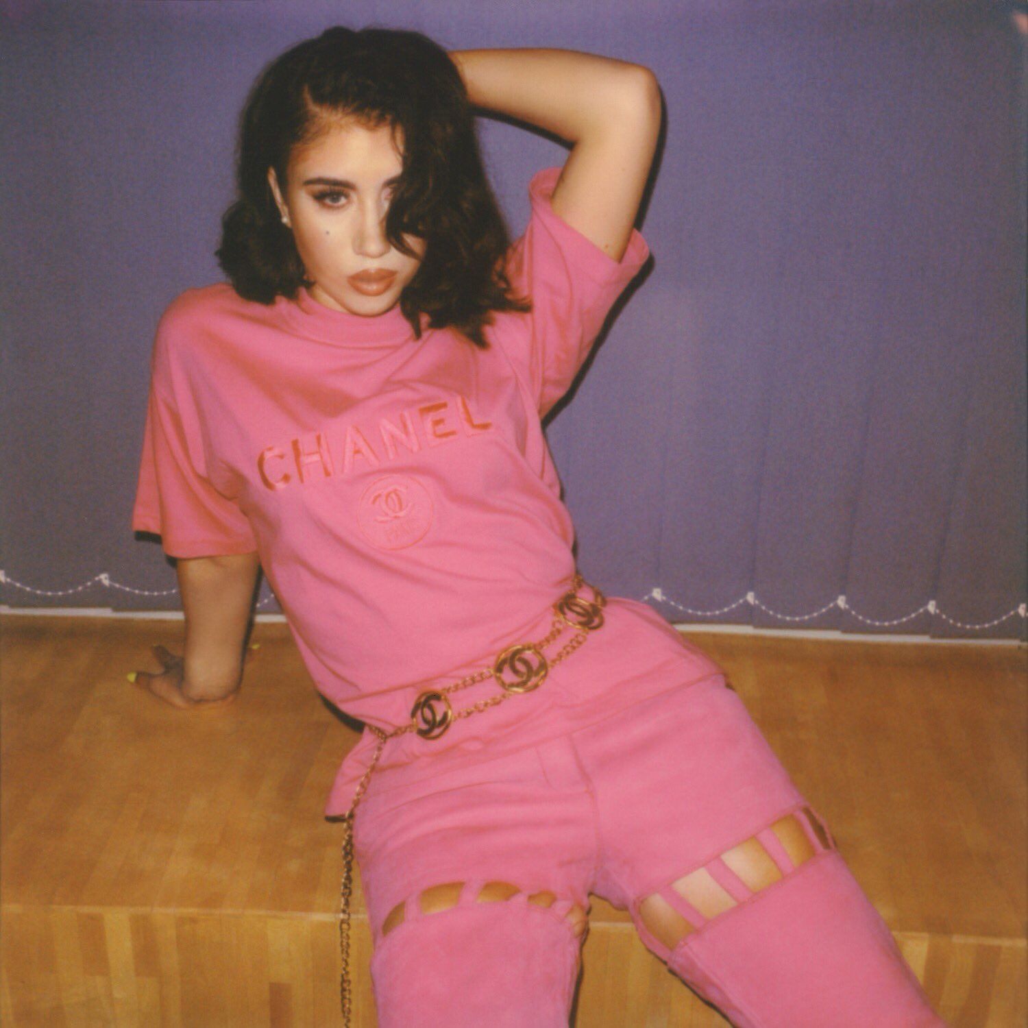 A woman in pink clothing posing for the camera - Kali Uchis