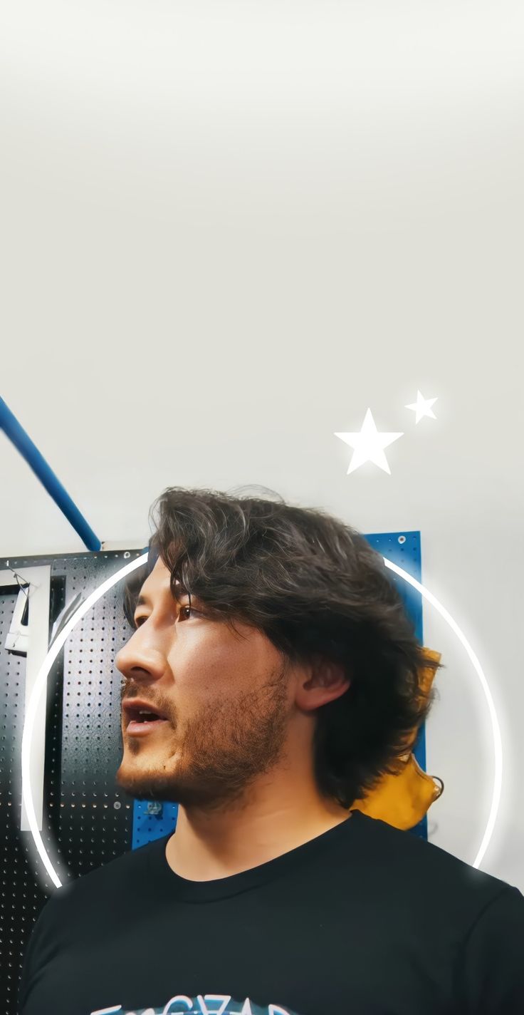 A man is standing in front of an air conditioner - Markiplier