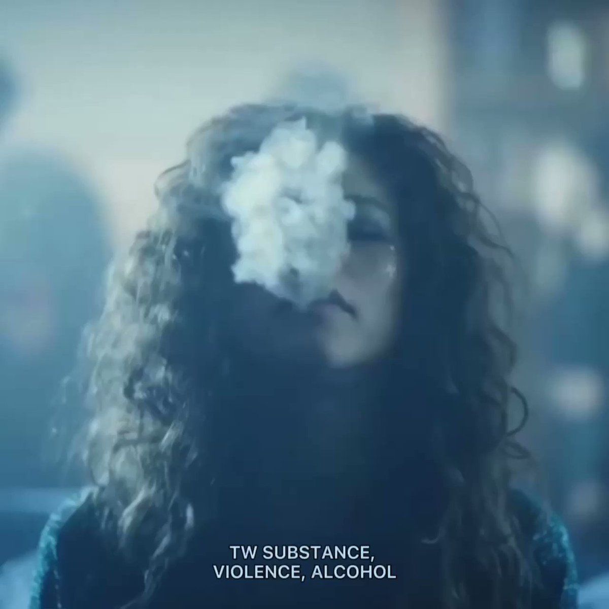 A woman smoking in front of people - Euphoria