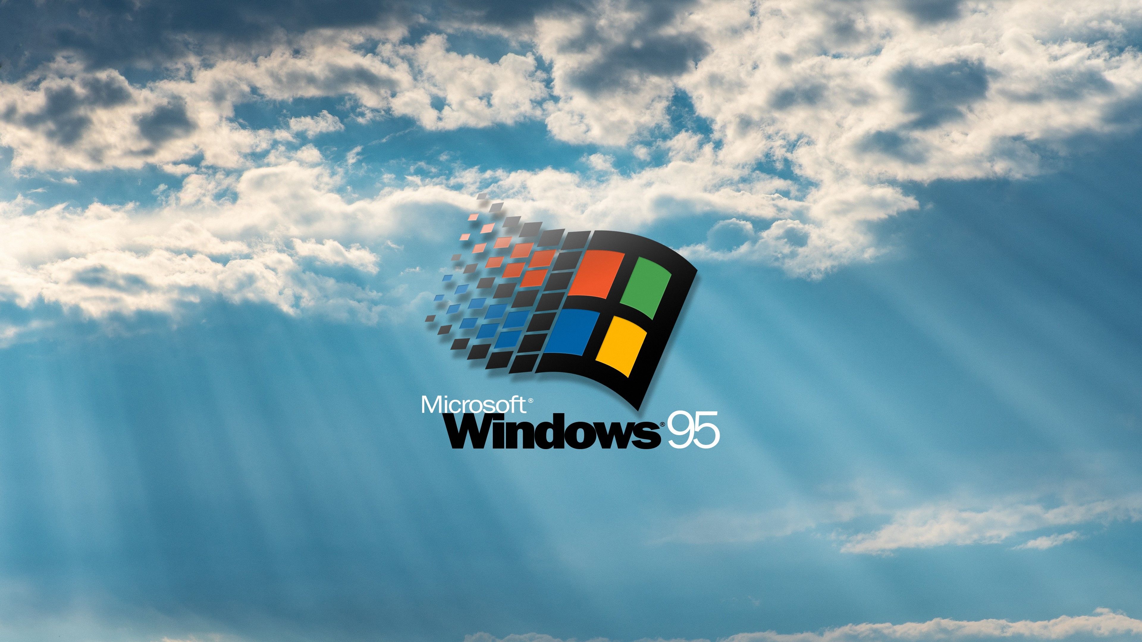 Windows 95 wallpaper with the sun shining through the clouds - Windows 95