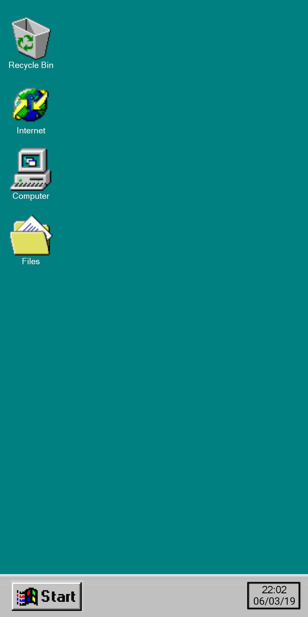A screenshot of a computer desktop with four icons. - Windows 98