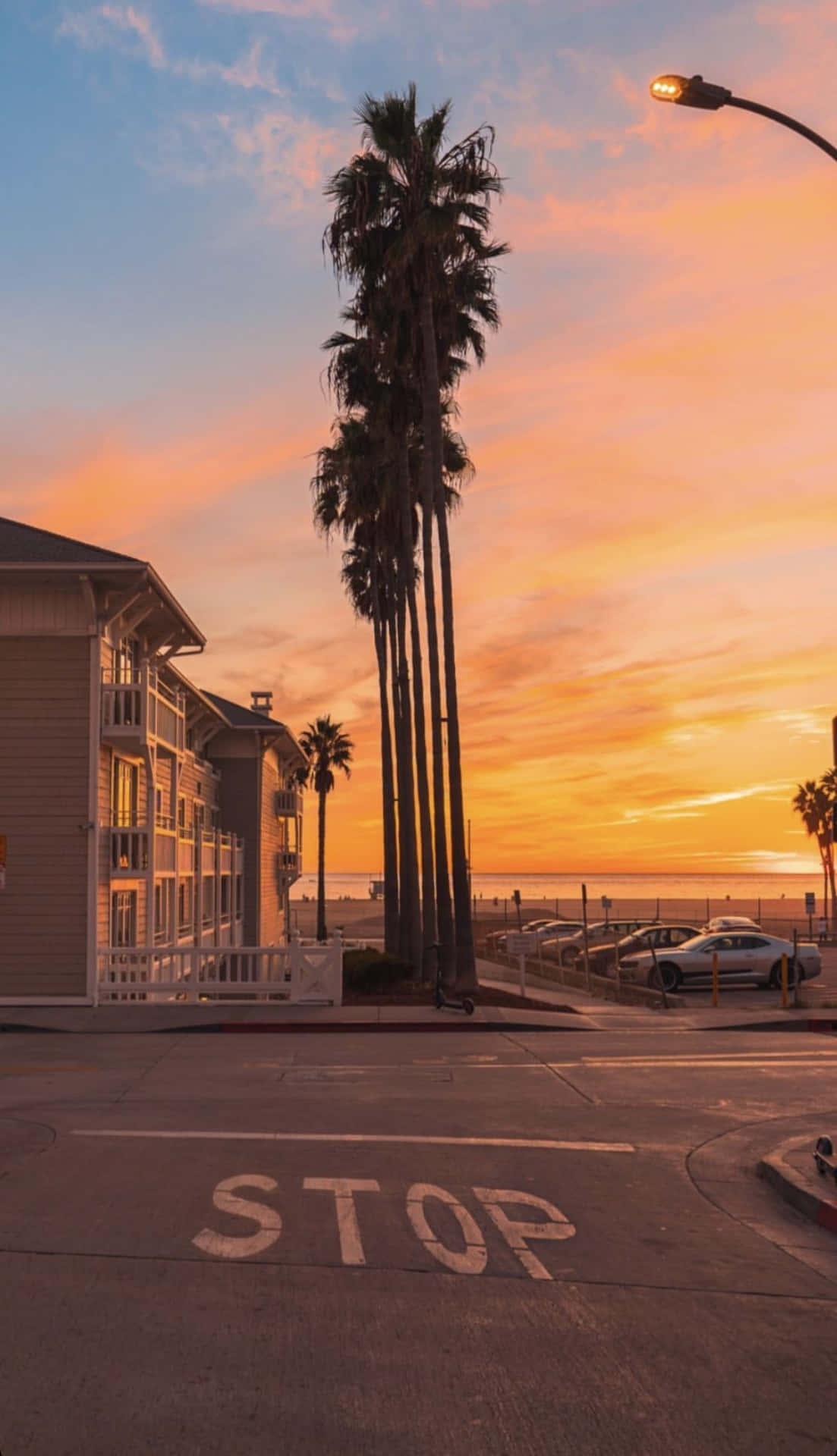 A stop sign on the street at sunset - California