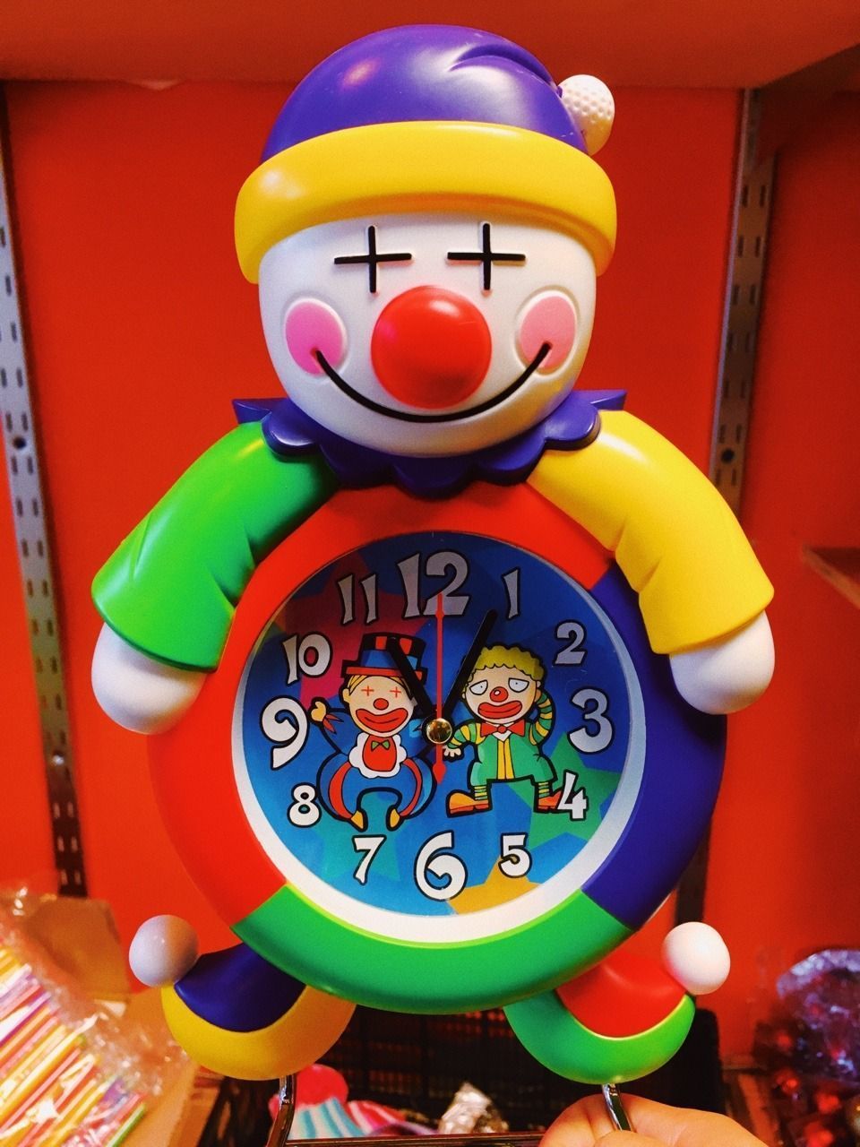 A colorful clown clock with two clowns on the front. - Clowncore