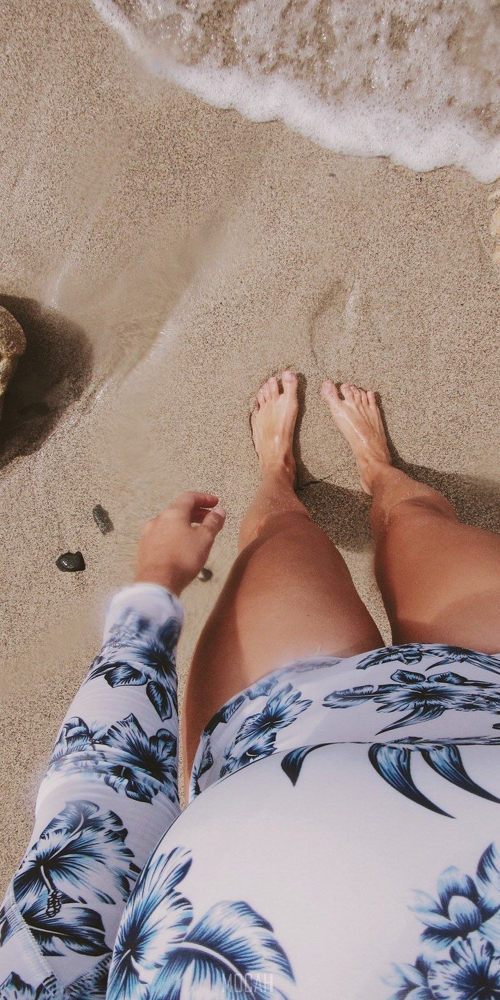A woman's feet in the sand at the beach - Beach