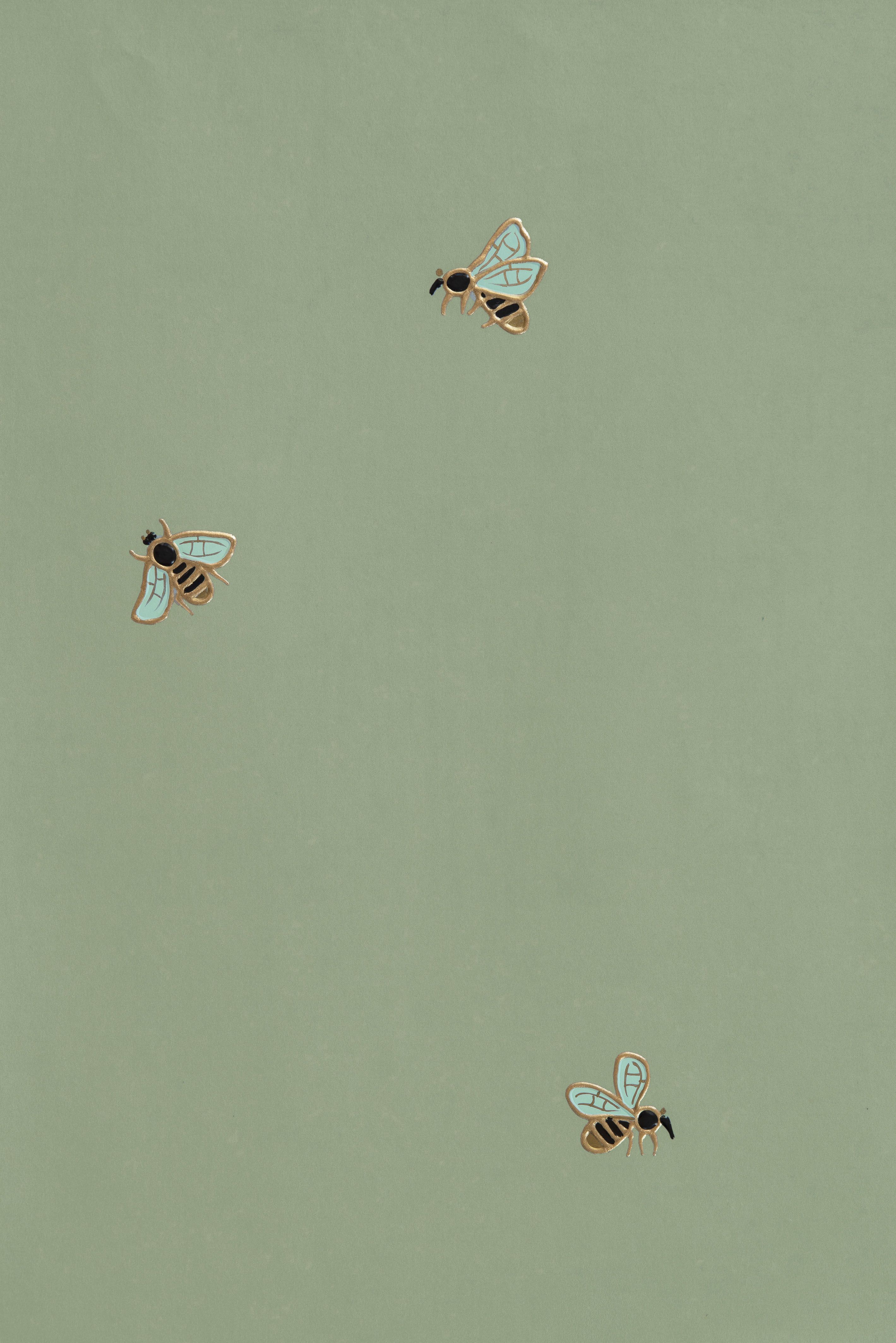 A close up of three bees on a green background - Sage green