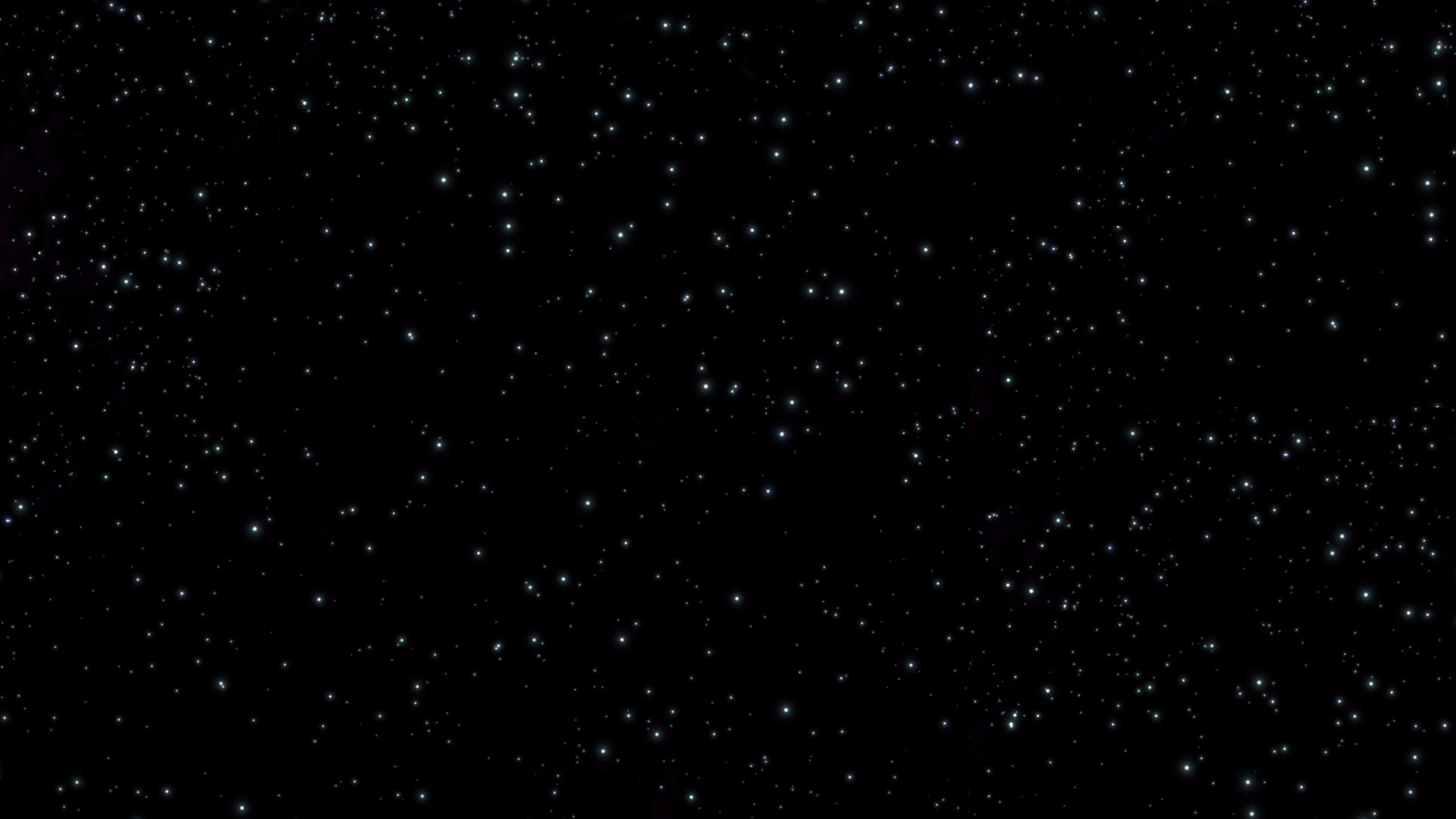 A black sky with stars and some clouds - Space