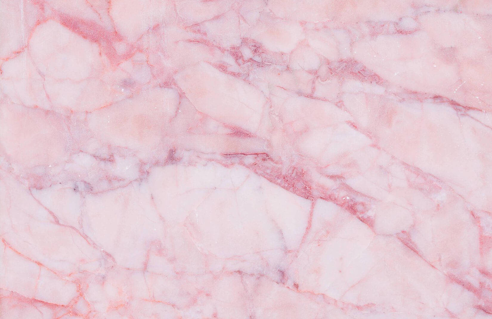 A pink marble wall with white lines - Marble