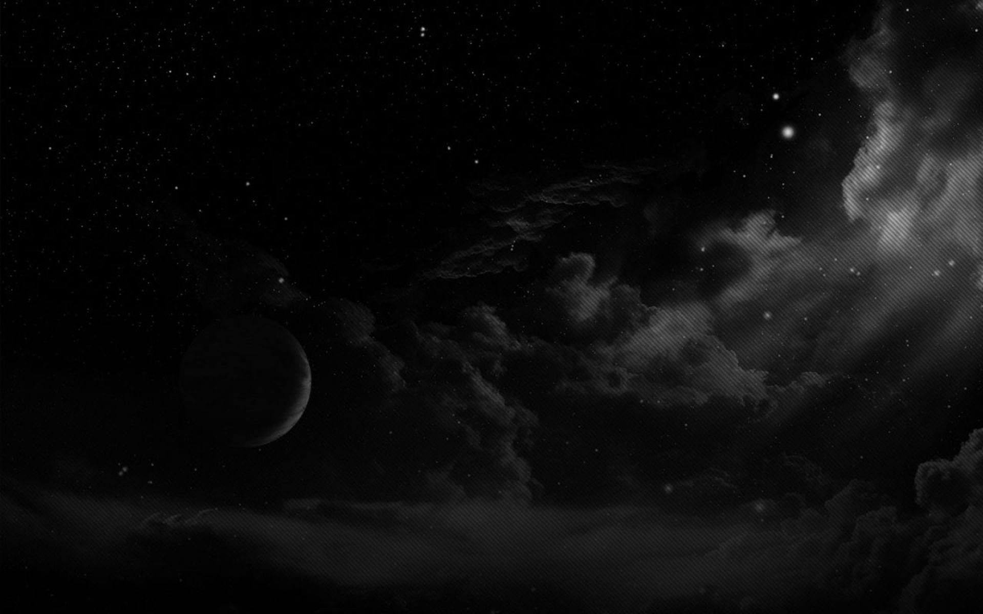 A black and white image of a planet in space. - Night