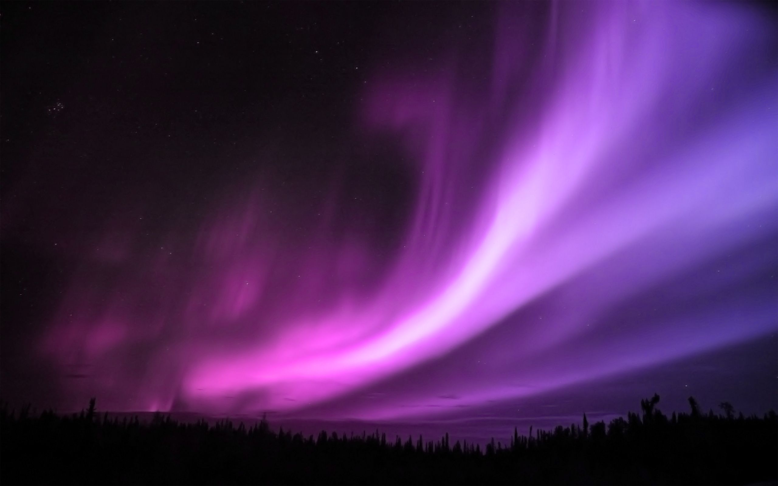 The Aurora Borealis, also known as the Northern Lights, is a natural light display in the Earth's atmosphere. - Night