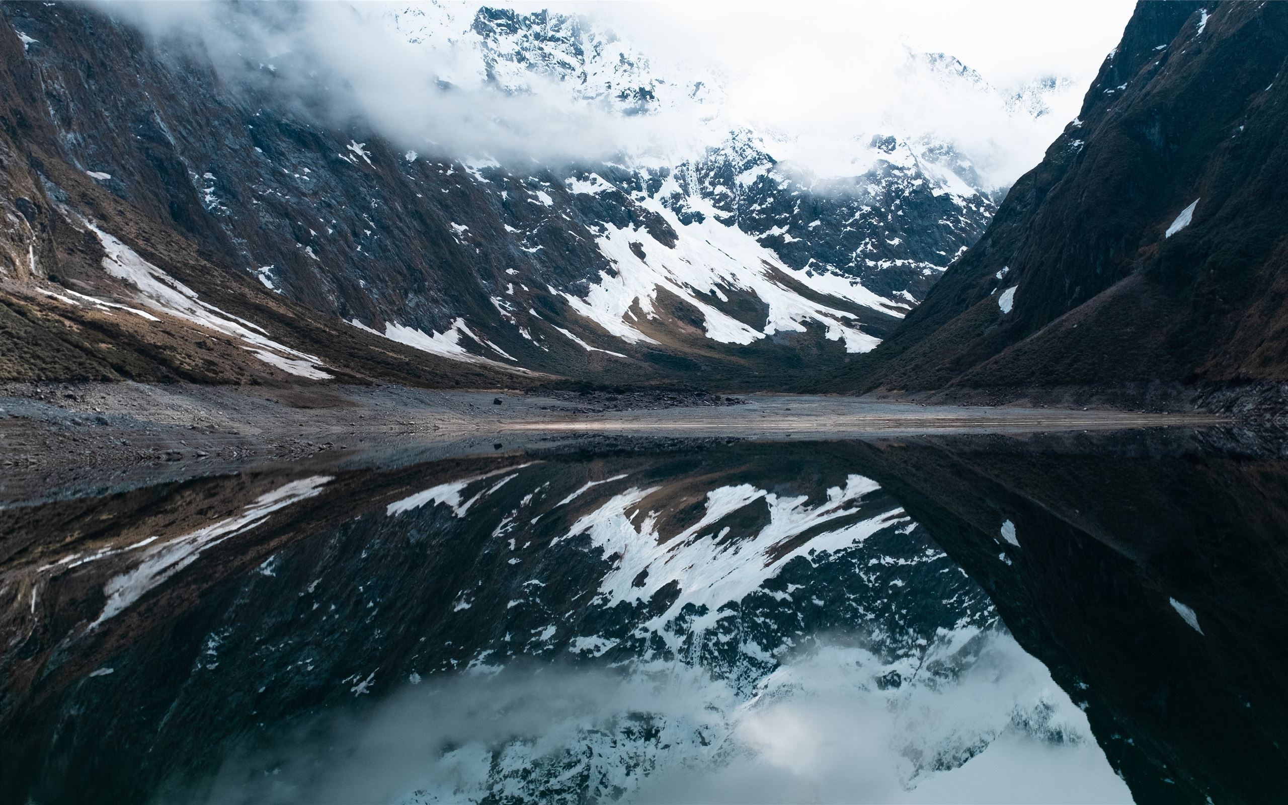 A snow covered mountain reflected in a lake - Travel