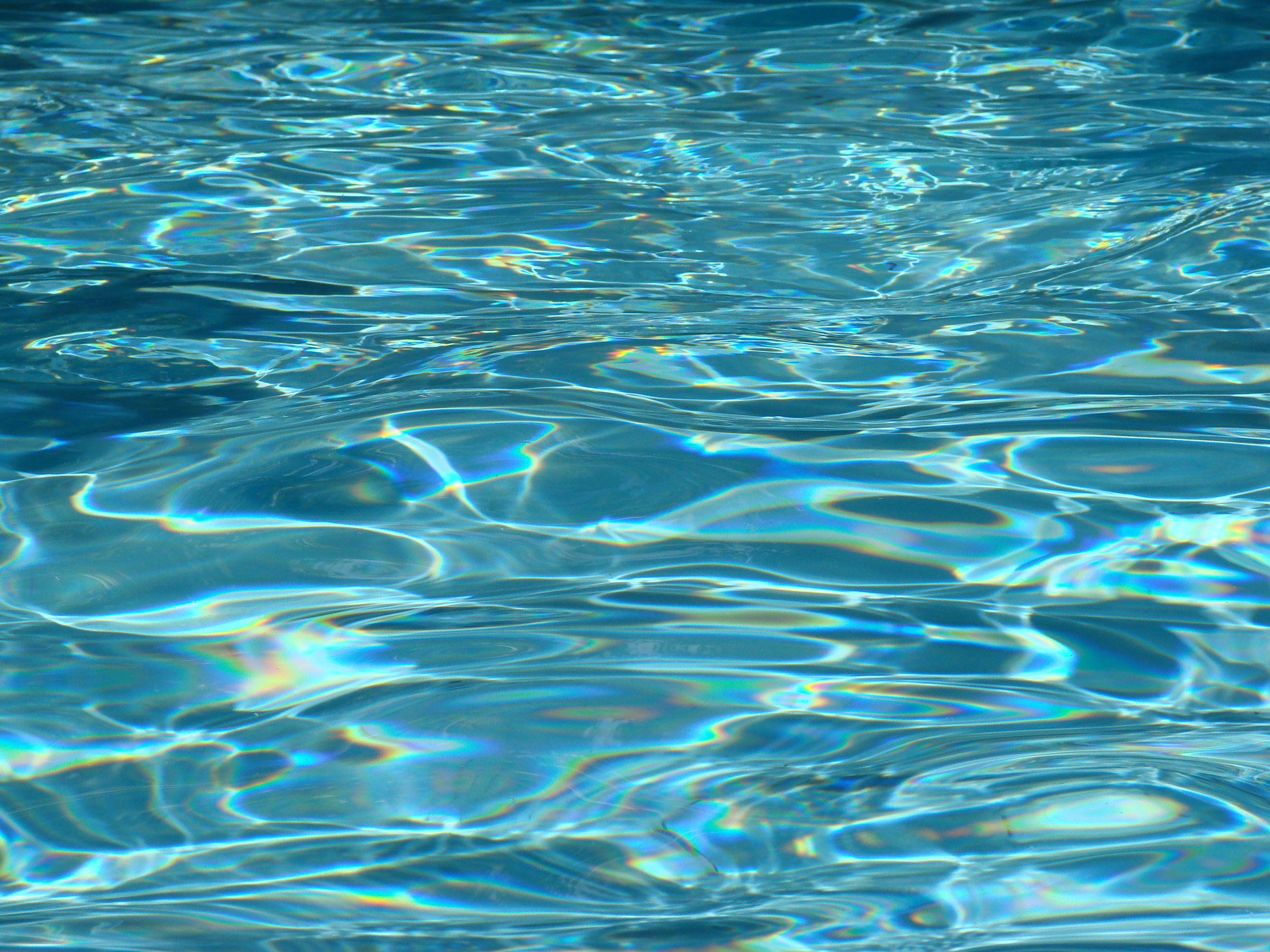 A close up of the water in an outdoor pool - Water