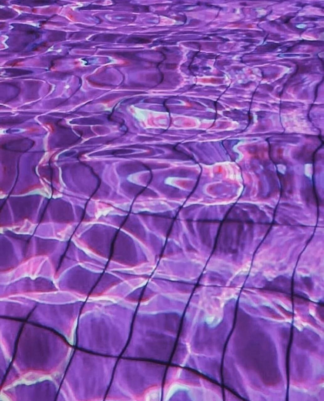 The water is purple and has ripples in it. - Water