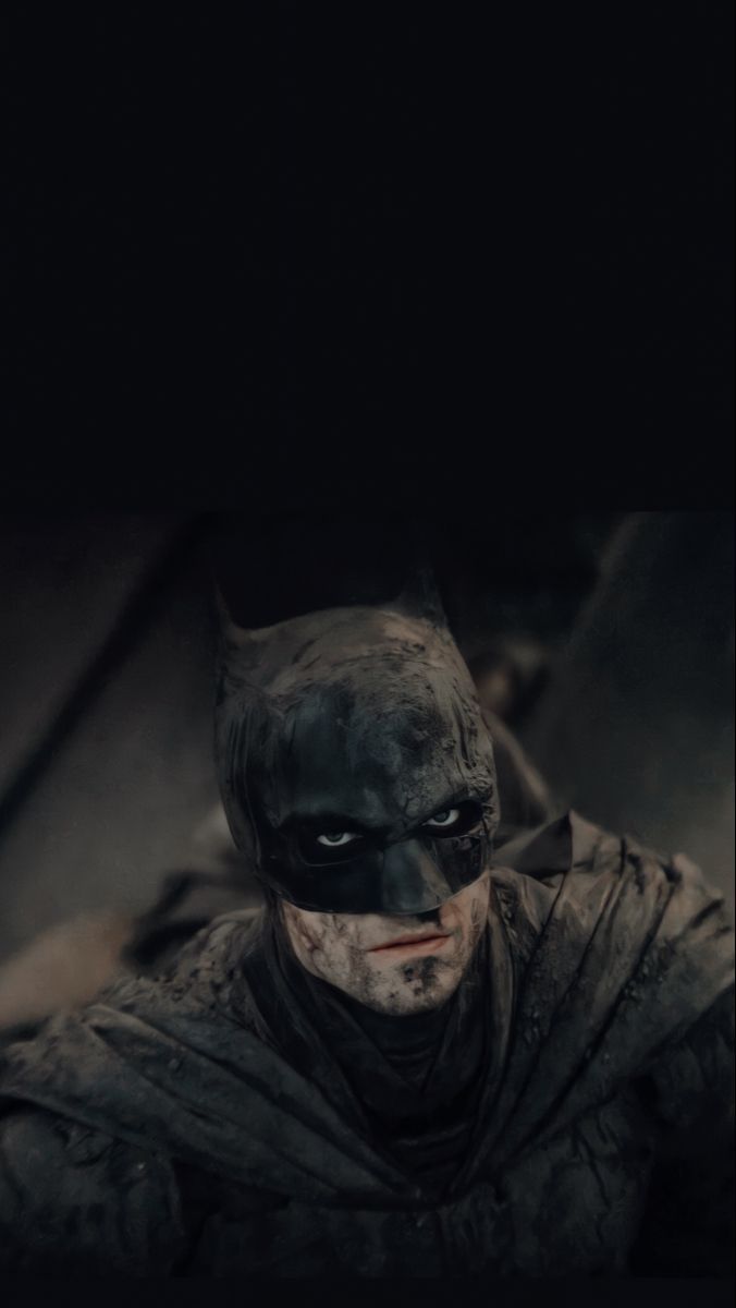 A batman is shown in the dark - Batman