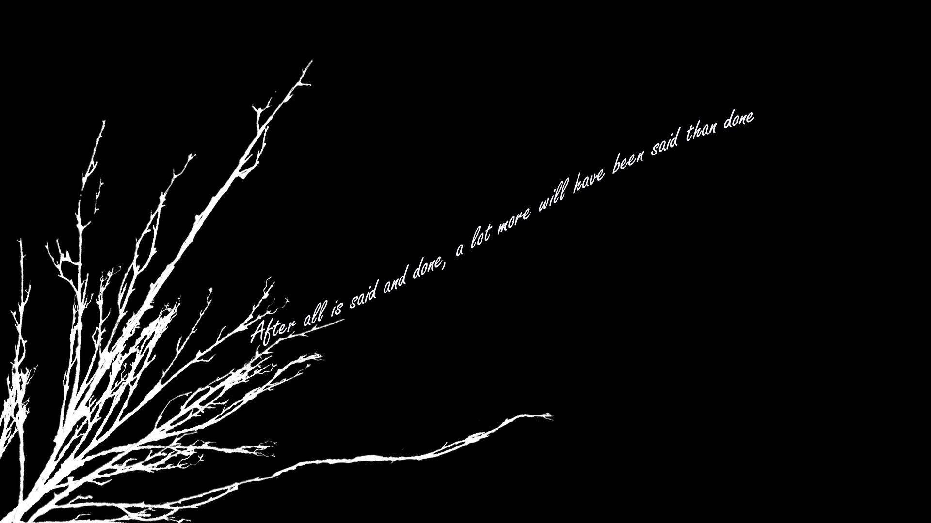 A black and white tree branch with the words 