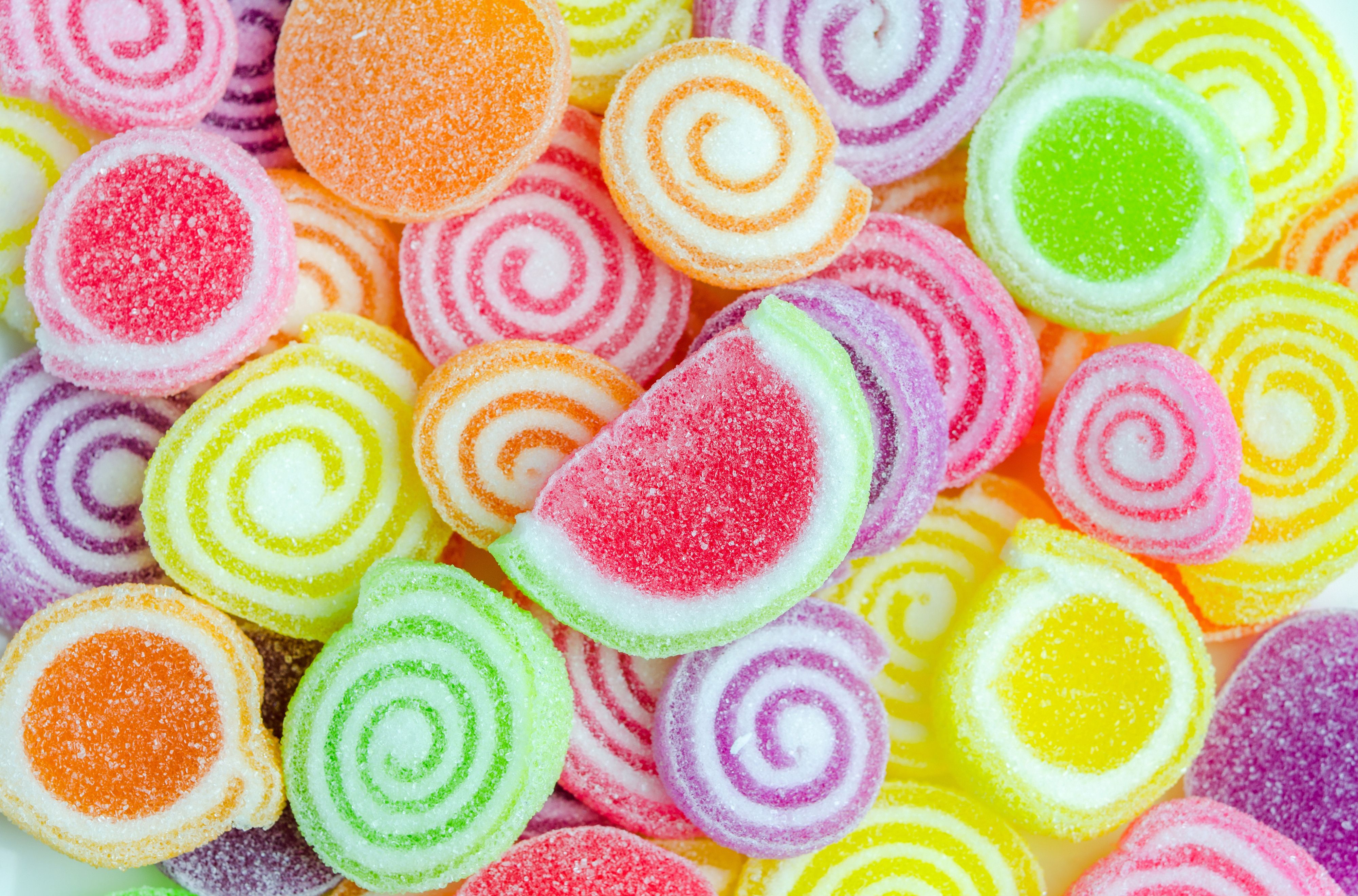 A pile of colorful candy on white background - Candy