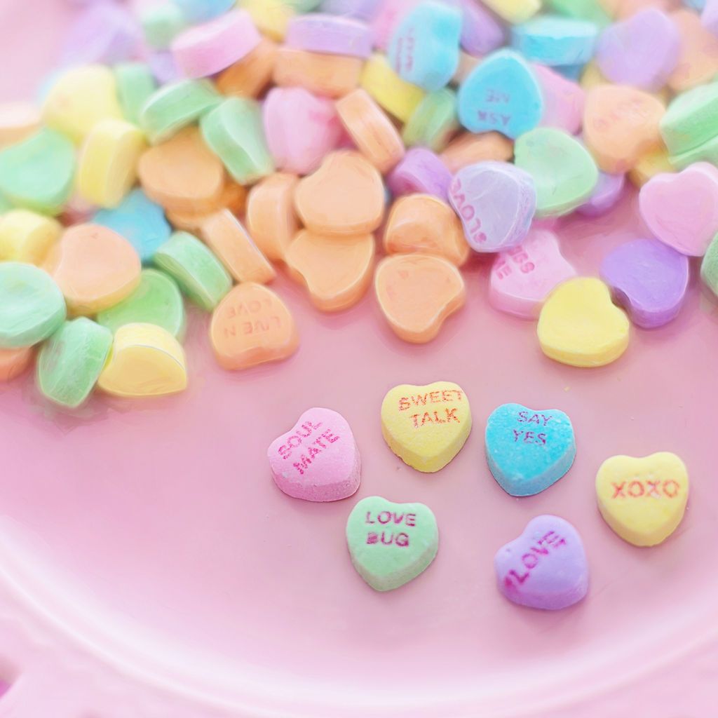 A plate of candy hearts with different messages on them - Candy