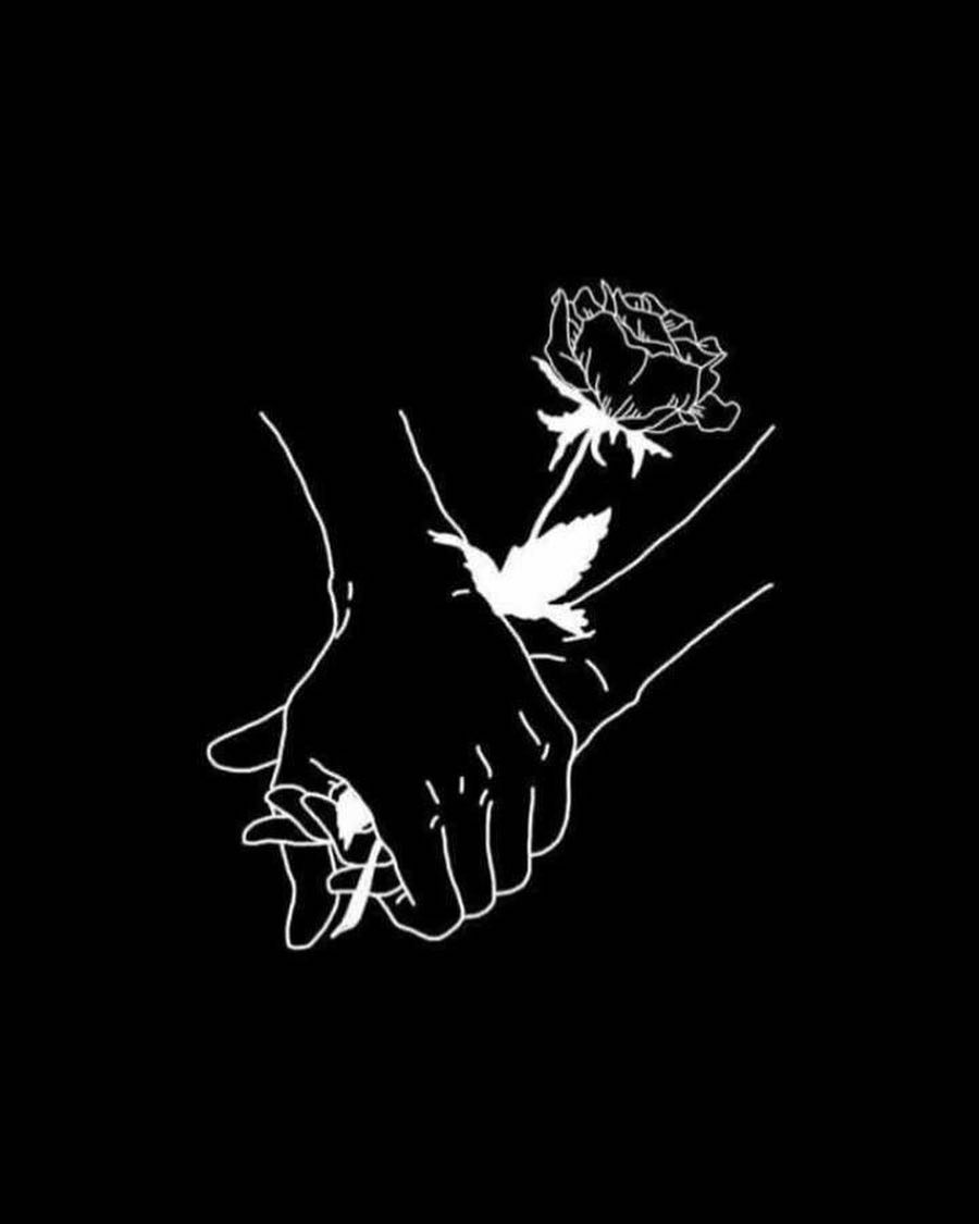 A black and white image of two hands holding flowers - Profile picture